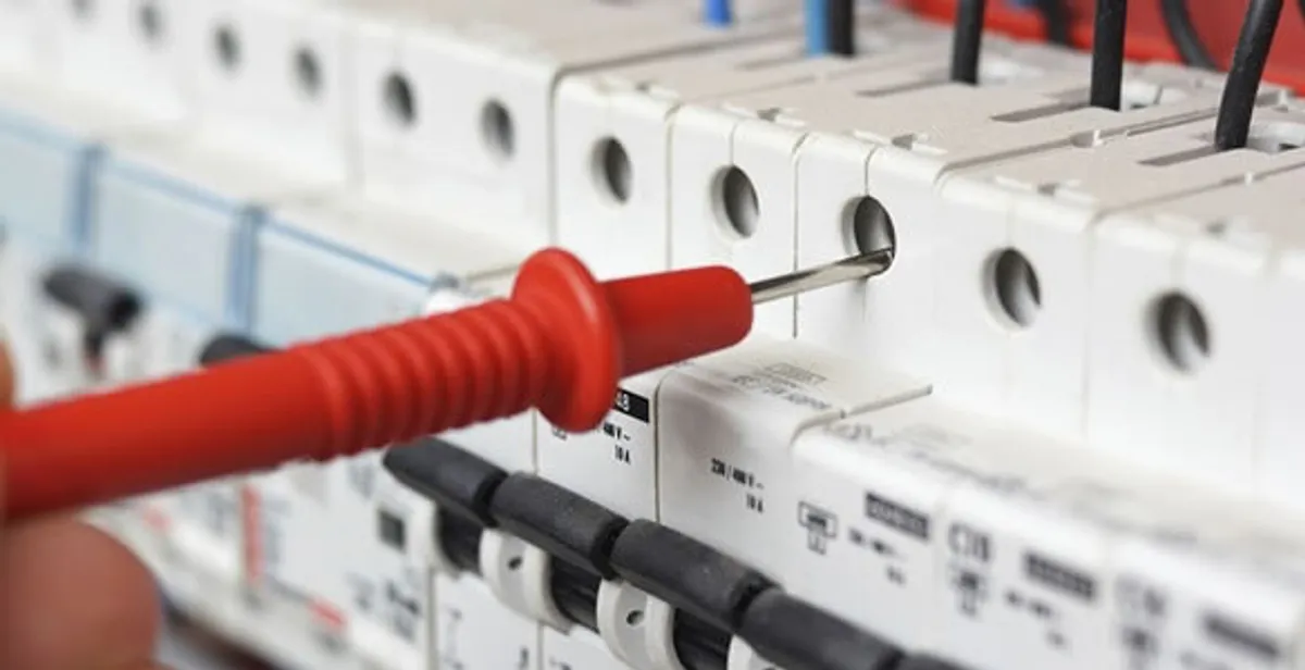Electrical contractor testing circuit breakers during electrical repair in Leland, NC