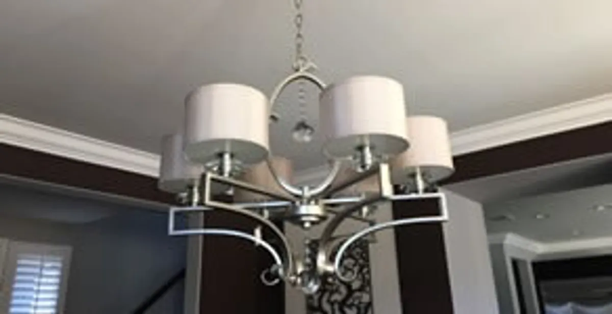 Modern chandelier installation with multiple light fixtures in Wilmington, NC